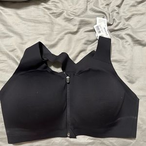 NWT Lululemon sports bra. Front zipper. Size 38DD, light padding